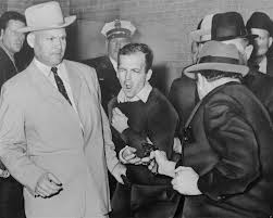 Lee Harvey Oswald fatally shot by Jack Ruby minutes after denigrating the Word of God 